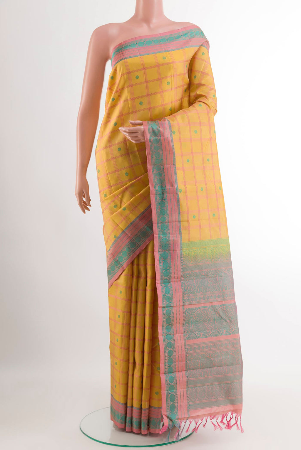 Yellow Kanchipuram Silk Saree with Checked design on the body and Thread Embroidery Border.  displayed on a mannequin