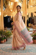 Model wearing a Sandal Kanchipuram Silk Saree with Thread Butta on the body and Thread Border.