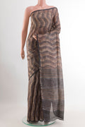 Grey Tussar Saree with Printed design on the body and Printed Border.  displayed on a mannequin
