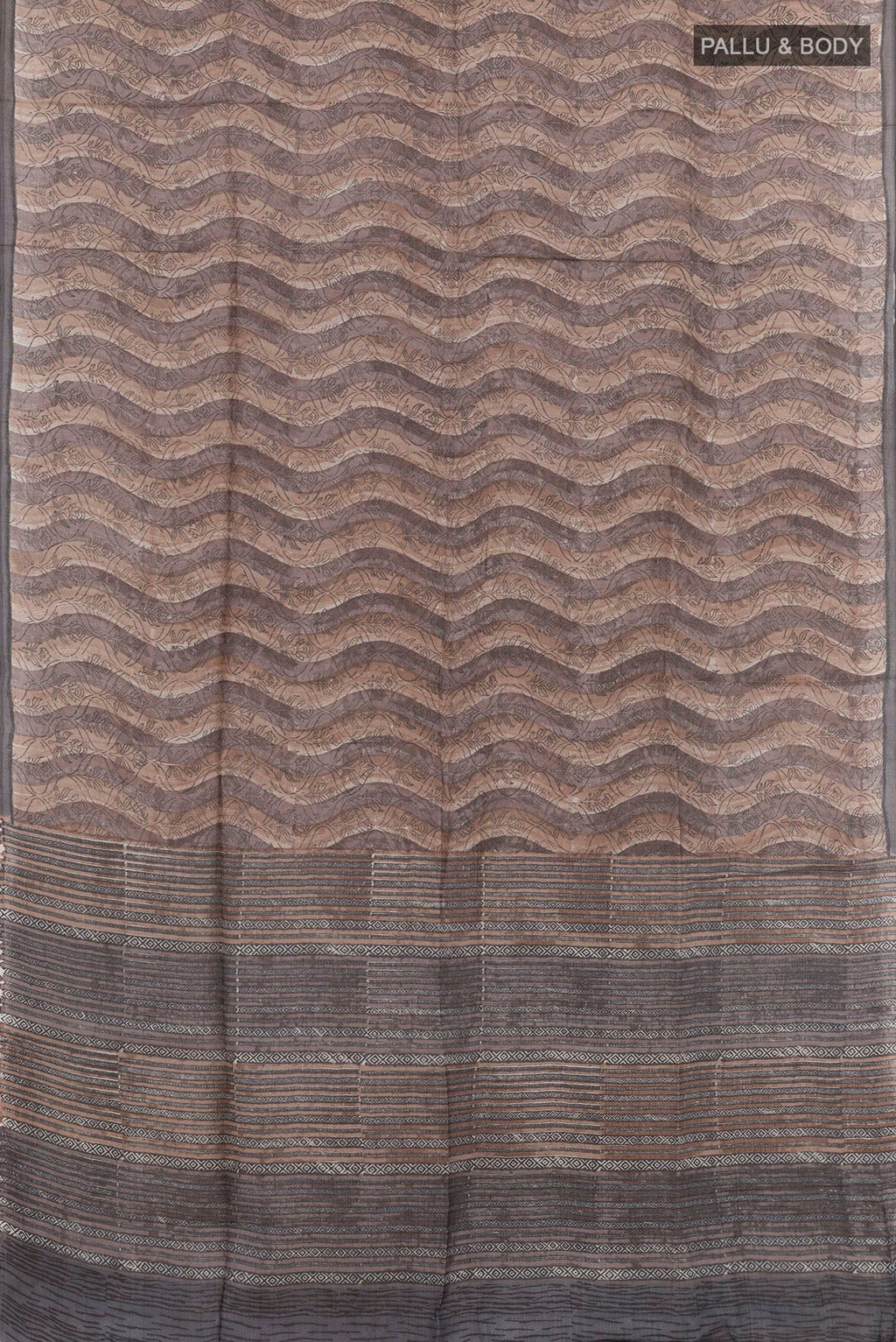 Flat view of Grey Tussar Saree with Printed design on the body and Printed Border. 