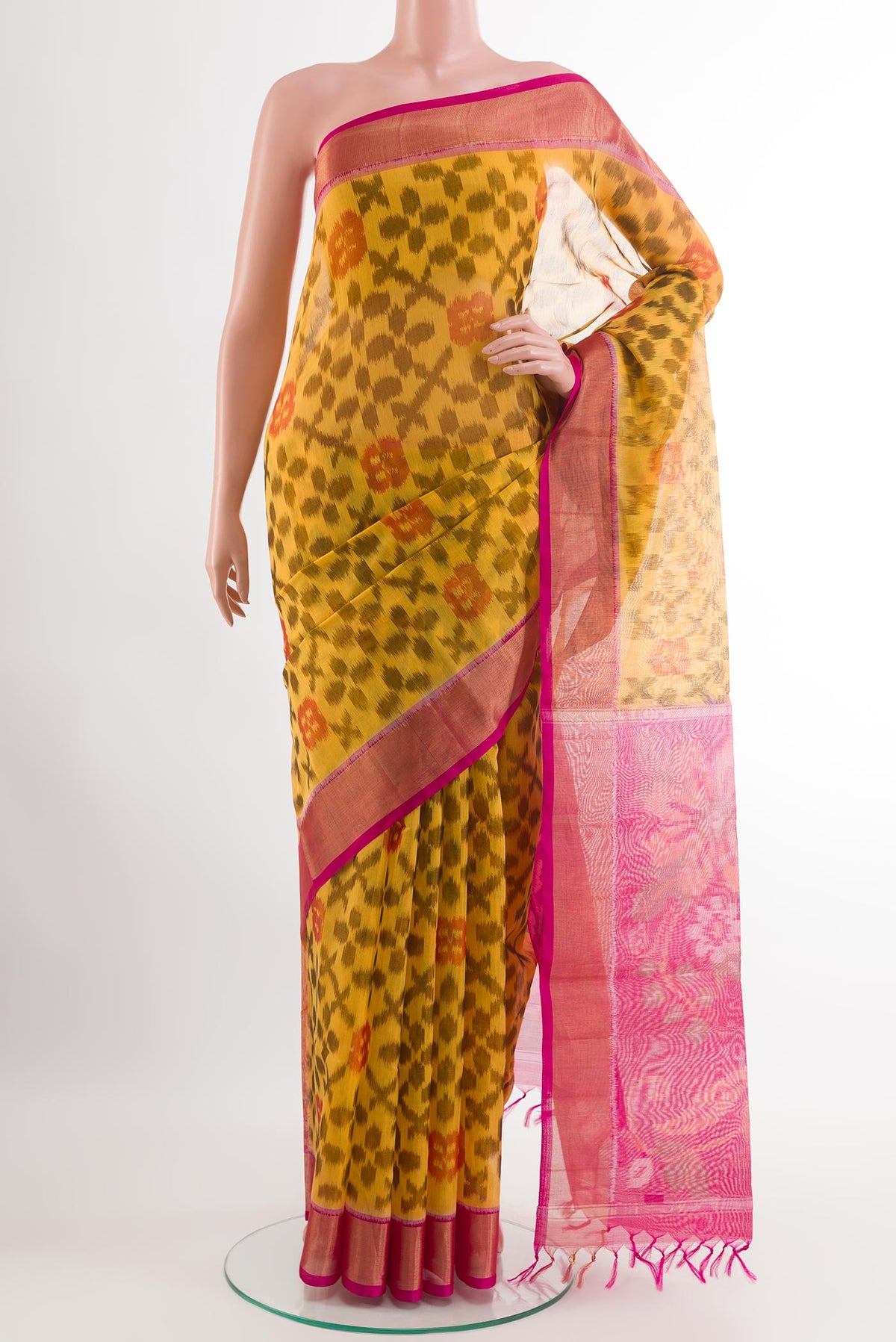 Yellow Blended Kora Cotton Saree with Ikat design on the body and Zari Border.  displayed on a mannequin