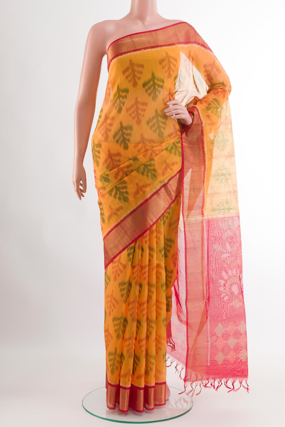 Yellow Blended Kora Cotton Saree with Ikat design on the body and Zari Border.  displayed on a mannequin