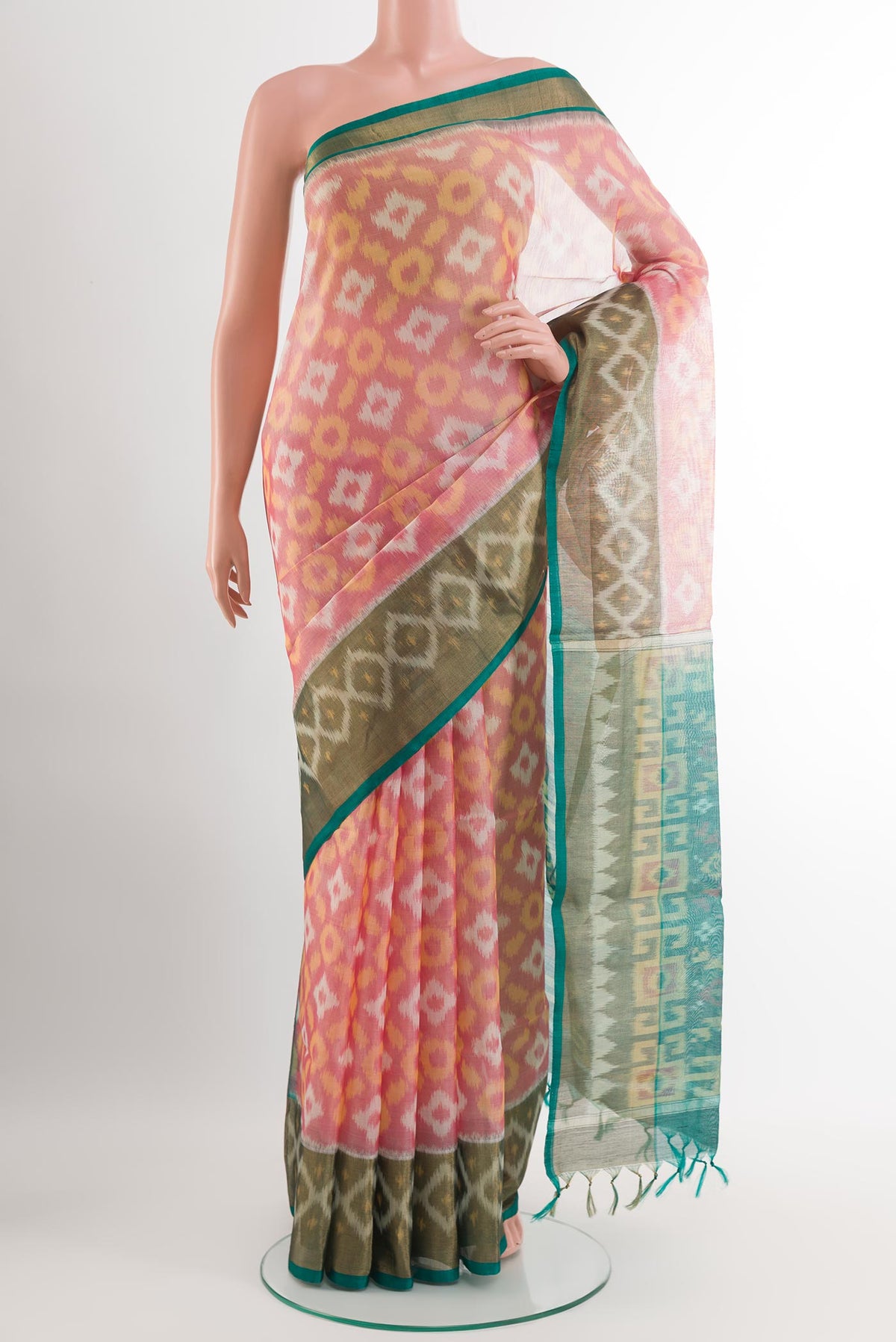 Red Blended Kora Cotton Saree with Ikat design on the body and Zari Border.  displayed on a mannequin