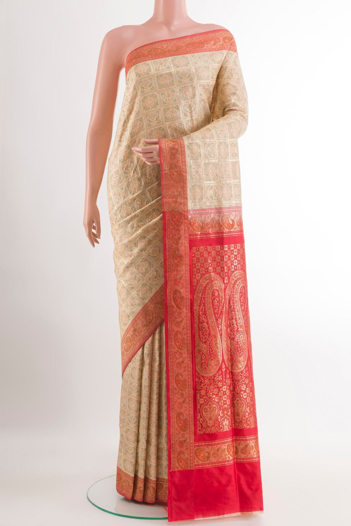 Cream Banarasi Jamavar Saree with Jacquard With Zari Butta on the body and Zari Border.  displayed on a mannequin