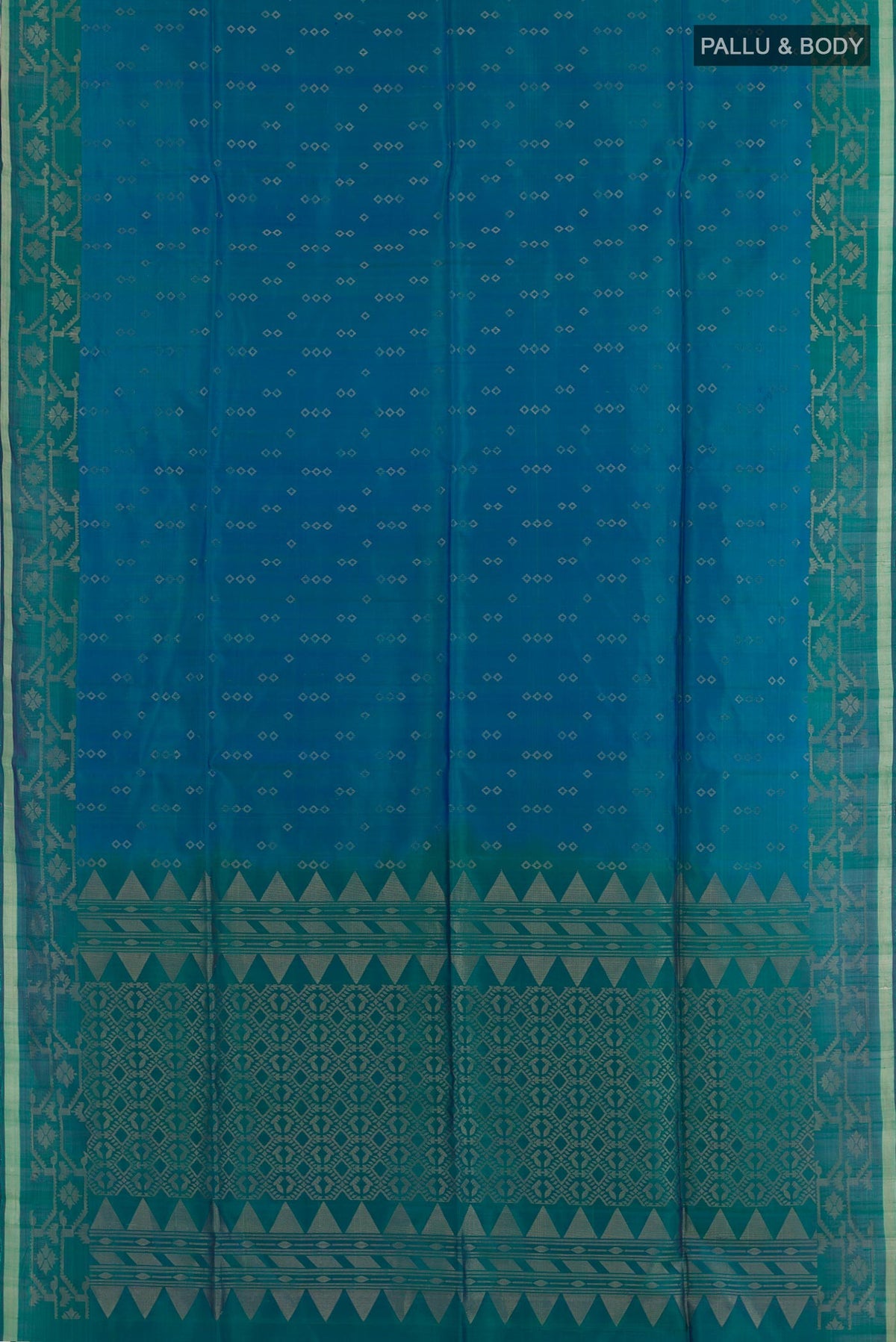 Flat view of Peacock Blue Soft Silk Saree with Zari Butta on the body and Zari Border. 