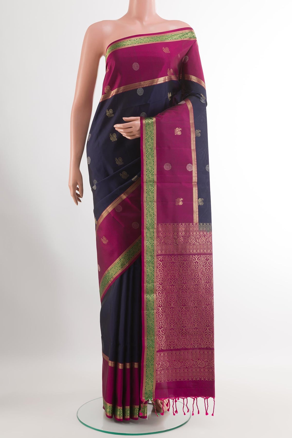 Dark Blue Soft Silk Saree with Zari Butta on the body and Zari Border.  displayed on a mannequin