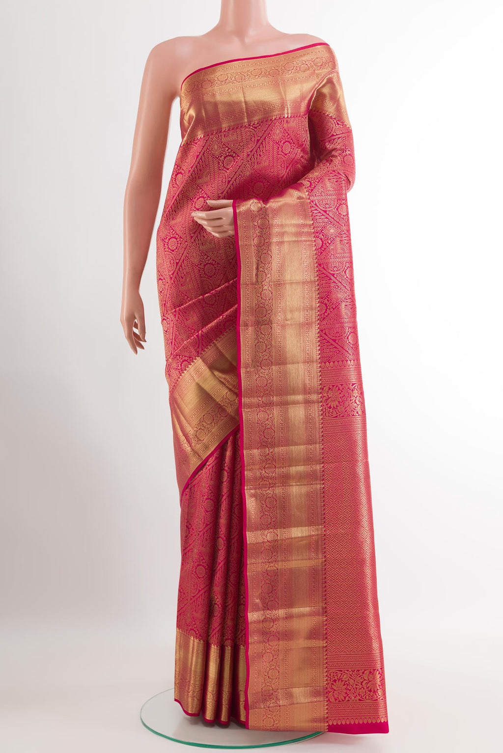 Rani Pink Kanchipuram Silk Saree with Zari Brocade on the body and Zari Border.  displayed on a mannequin