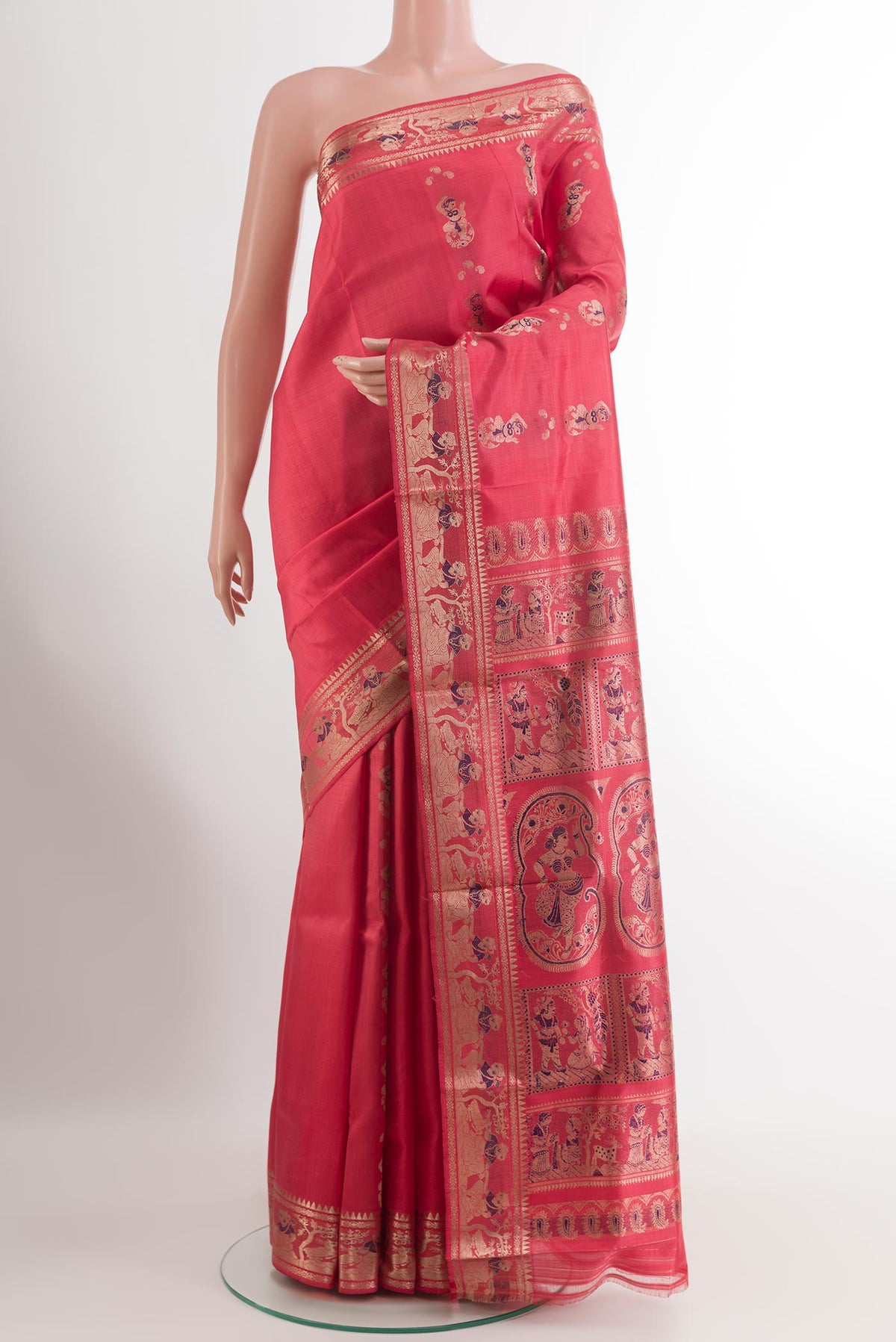 Coral Baluchari Silk Saree with Zari And Thread Butta on the body and Zari Border.  displayed on a mannequin