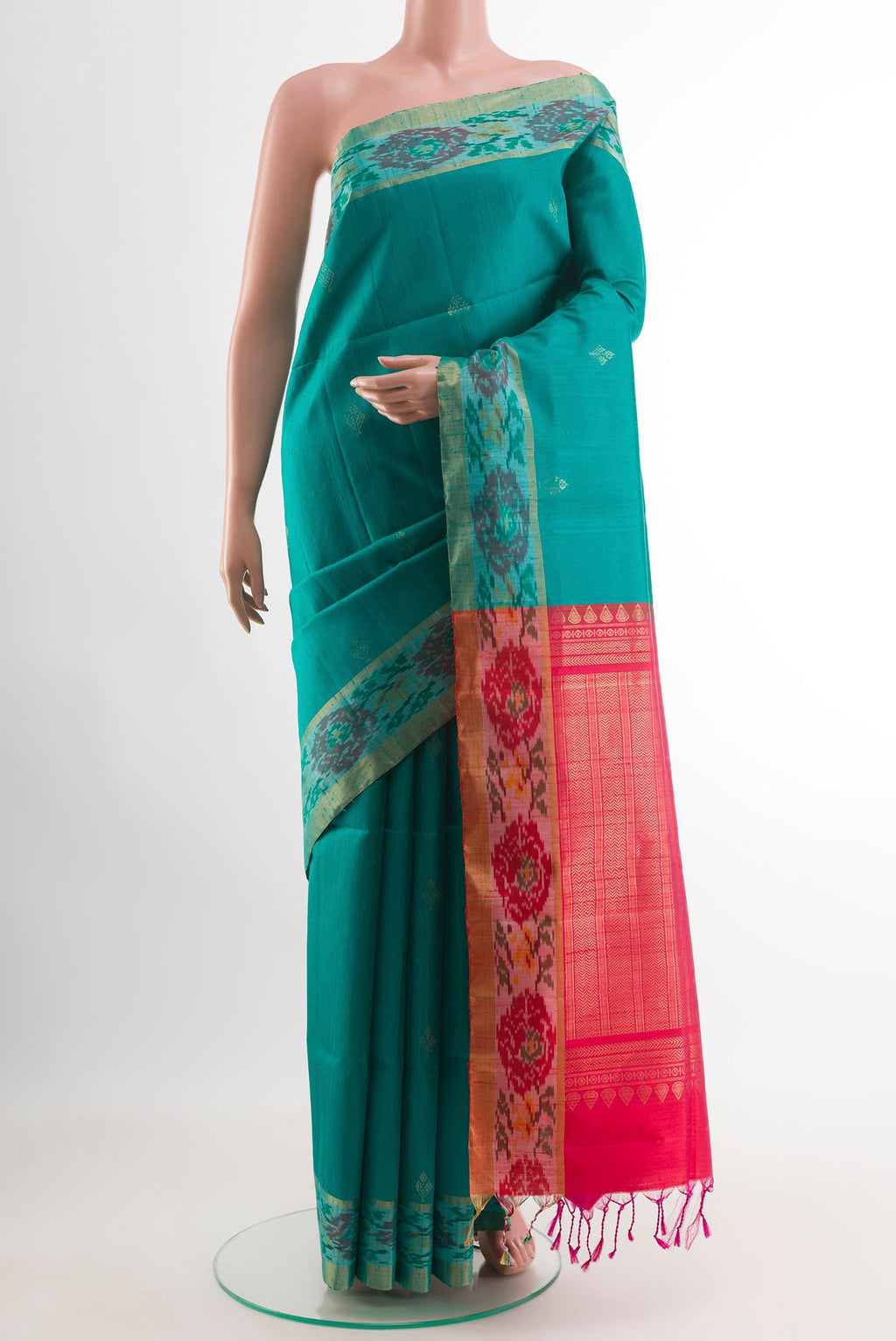 Blue Raw Silk Saree with Zari Butta on the body and Zari Border.  displayed on a mannequin