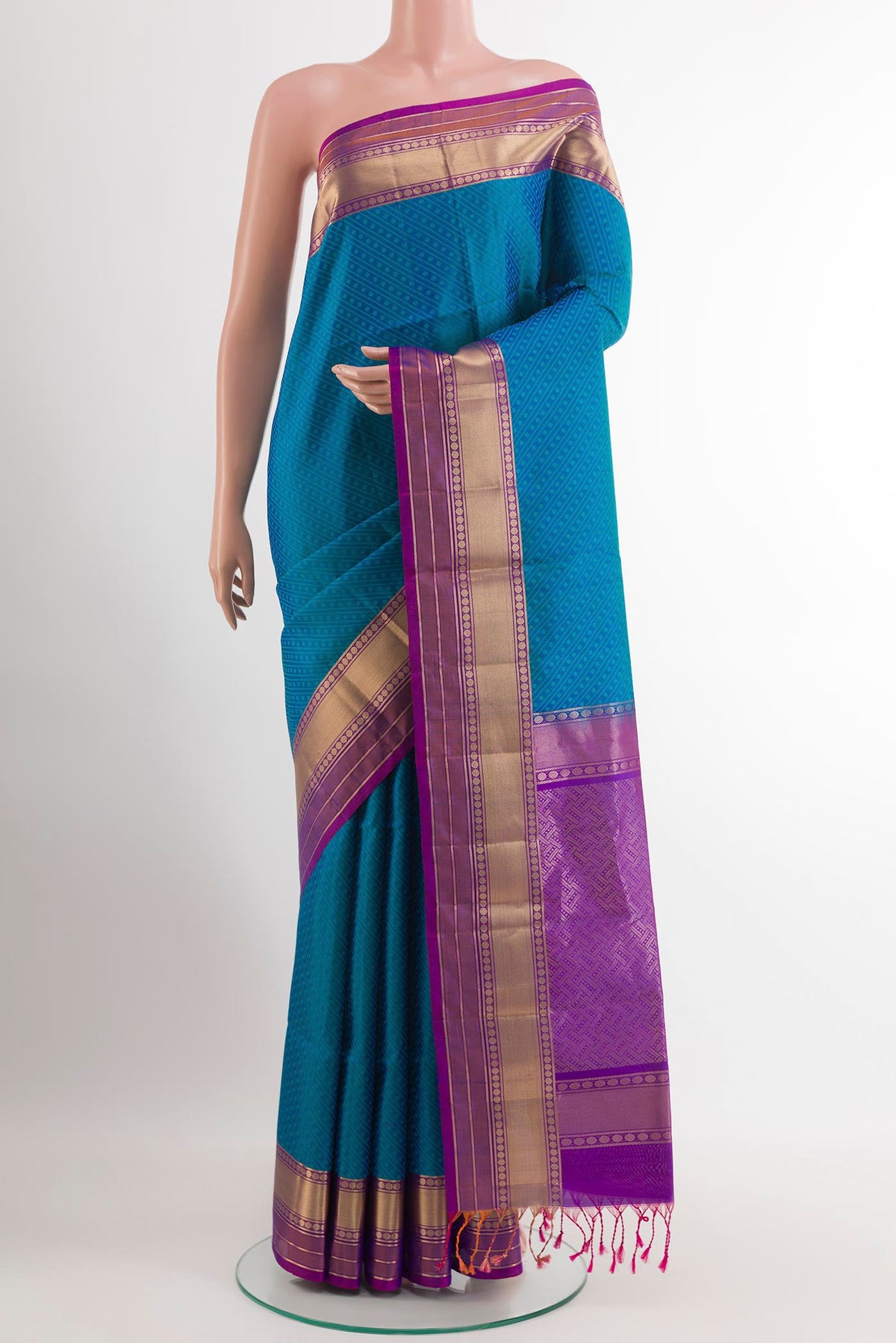 Blue Soft Silk Saree with Jacquard design on the body and Zari Border.  displayed on a mannequin
