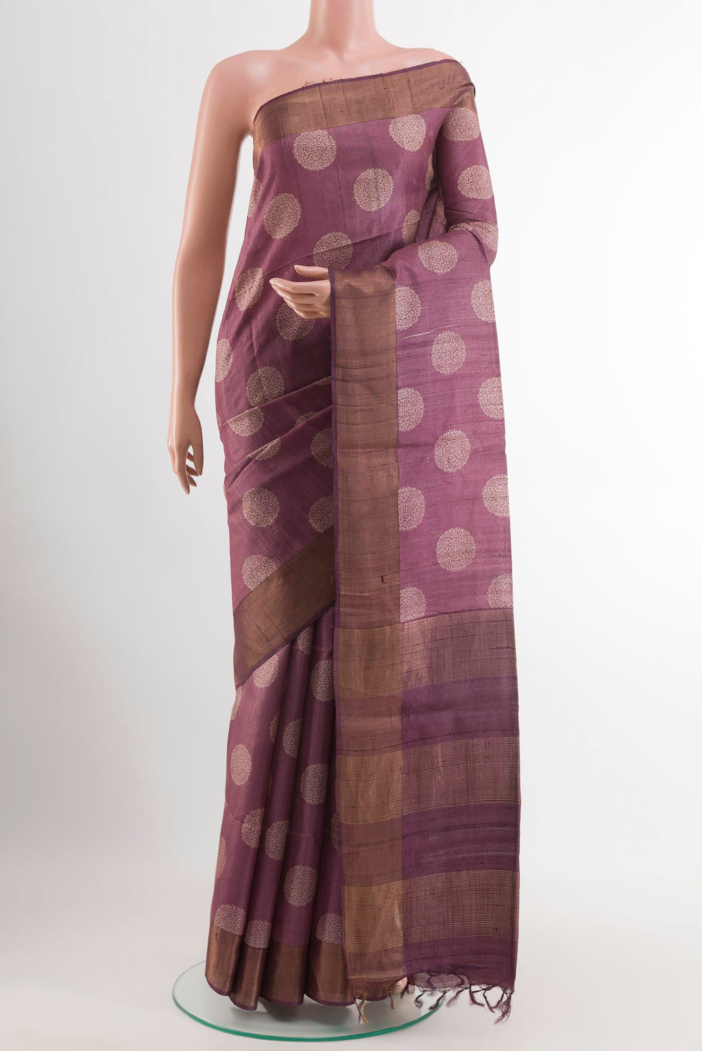Purple Tussar Saree with Printed design on the body and Zari Border.  displayed on a mannequin
