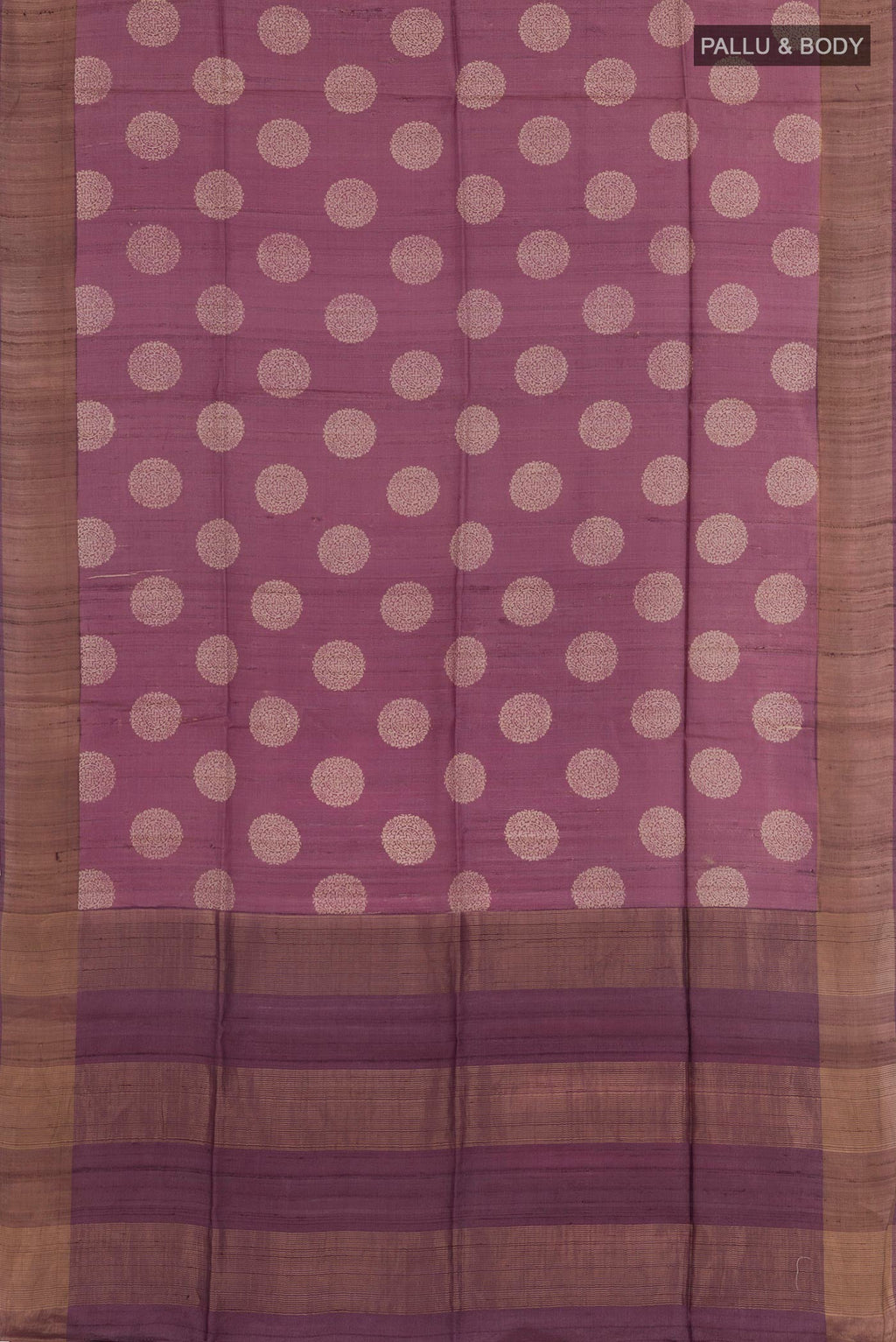 Flat view of Purple Tussar Saree with Printed design on the body and Zari Border. 