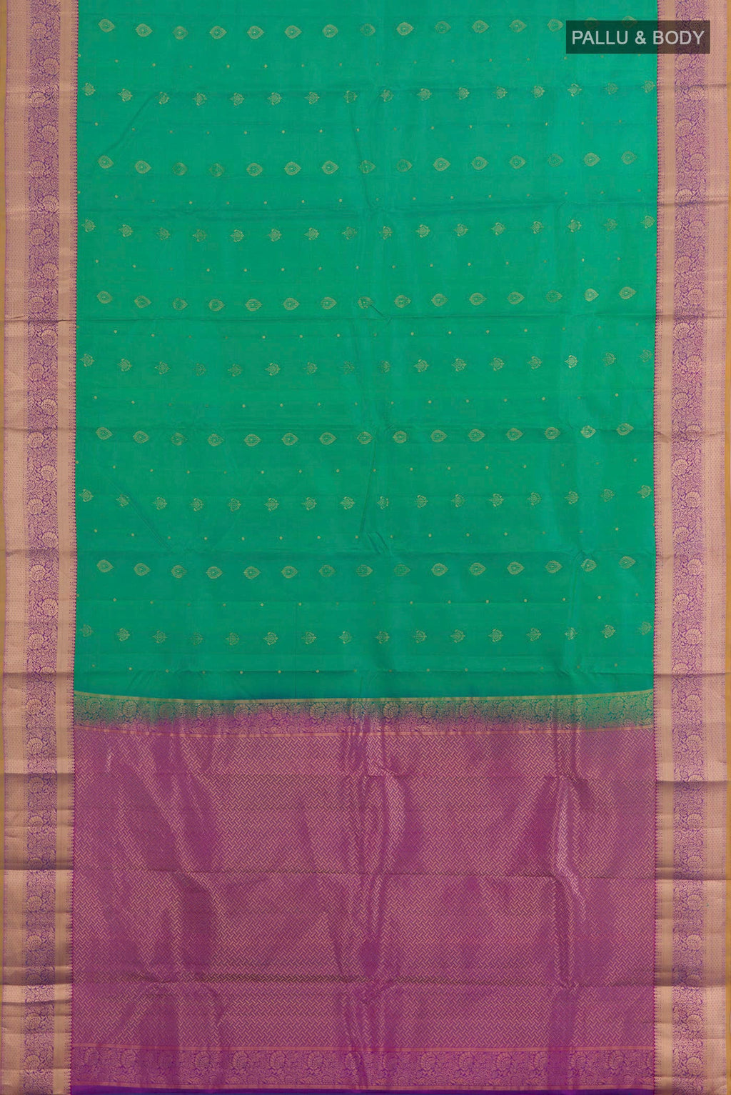 Flat view of Green Kanchipuram Silk Saree with Zari Butta on the body and Zari Border. 