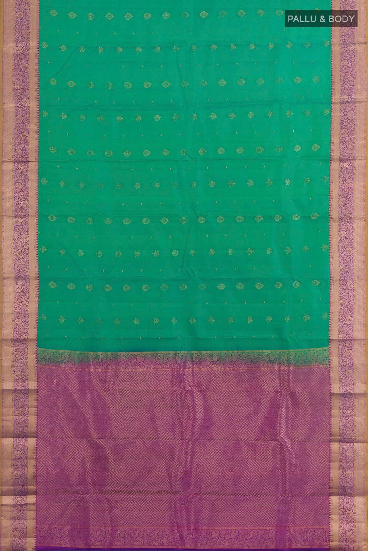 Flat view of Green Kanchipuram Silk Saree with Zari Butta on the body and Zari Border. 