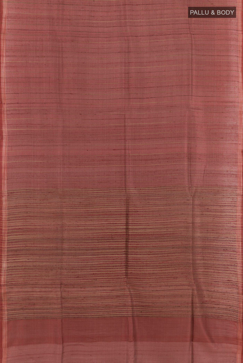 Flat view of Brick Orange Tussar Saree with Printed design on the body and Zari Border. 