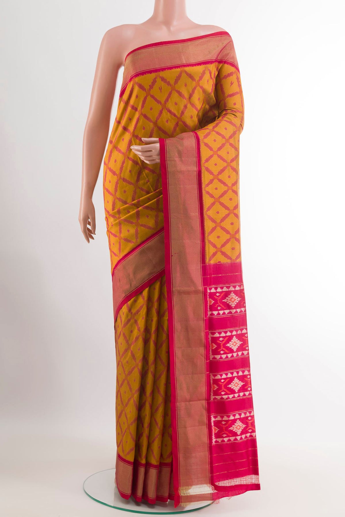 Yellow Pochampally Silk Saree with Ikat design on the body and Plain Border.  displayed on a mannequin