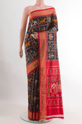 Black Pochampally Silk Saree with Pure Ikat on the body and Zari Border.  displayed on a mannequin