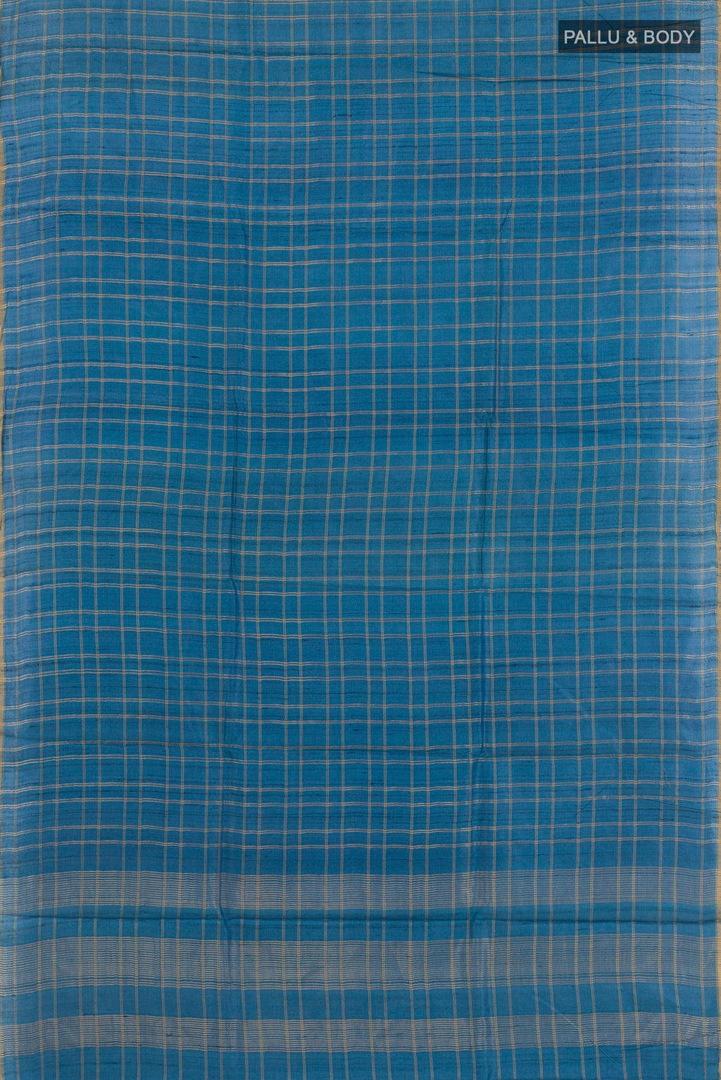 Flat view of Blue Tussar Saree with Checked design on the body and Zari Border. 