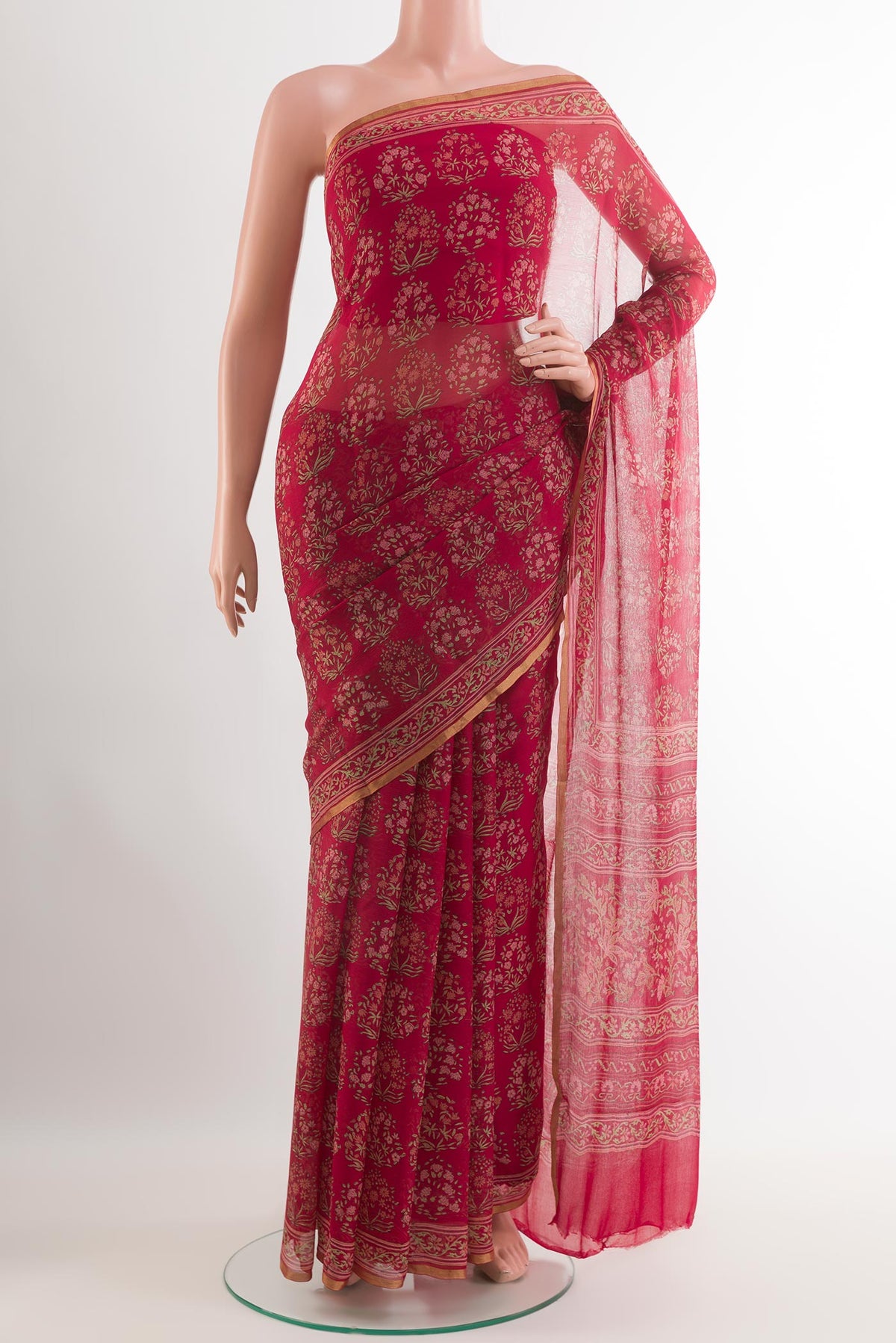 Red Chiffon Saree with Printed design on the body and Plain Border.  displayed on a mannequin