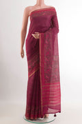 Purple Tussar Saree with Stripes on the body and Zari Border.  displayed on a mannequin