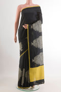 Black Tussar Saree with Printed design on the body and Thread Embroidery Border.  displayed on a mannequin