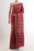 Red Tussar Saree with Checked design on the body and Zari Border.  displayed on a mannequin