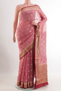 Pink Linen Saree with Zari Butta on the body and Zari Border.  displayed on a mannequin