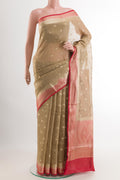 Beige Linen Saree with Zari Butta on the body and Zari Border.  displayed on a mannequin