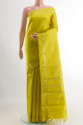Yellow Kanchipuram Silk Saree with Zari Butta on the body and Zari Border.  displayed on a mannequin