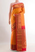 Orange Kanchipuram Silk Saree with Checked design on the body and Ganga Jamuna Border.  displayed on a mannequin