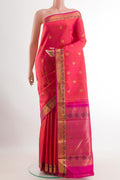 Pink Kanchipuram Silk Saree with Zari Butta on the body and Zari Border.  displayed on a mannequin