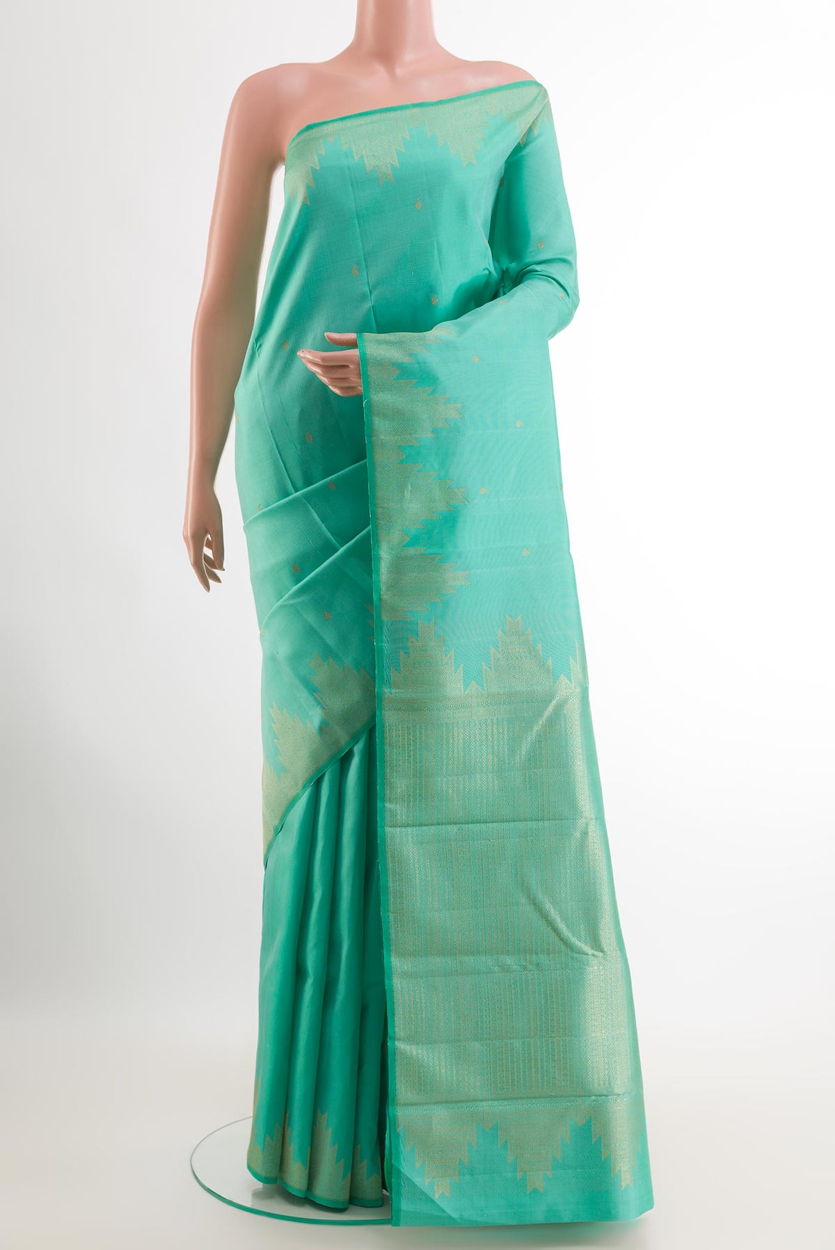 Turquoise Kanjivaram Silk Saree with Zari Butta on the body and Zari Border.  displayed on a mannequin