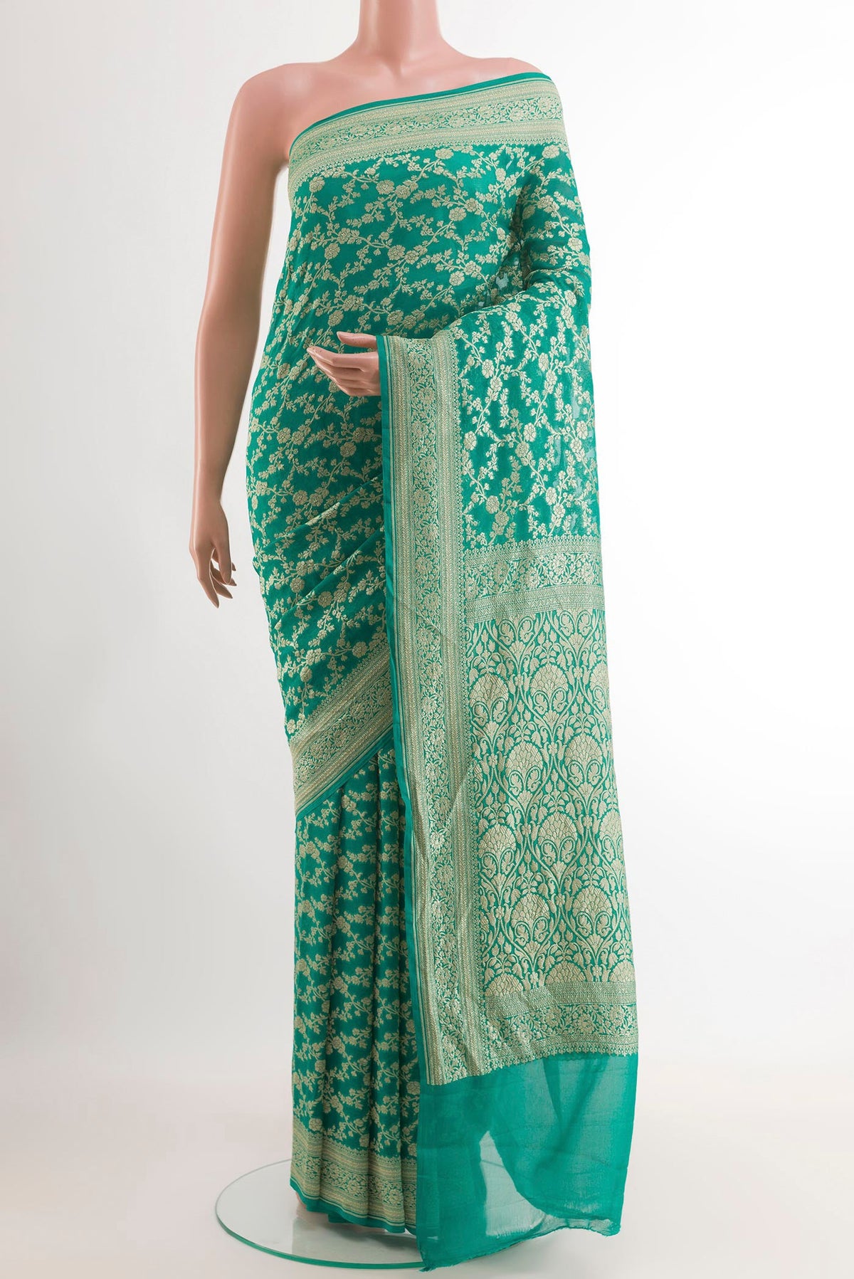 Sea Green Banarasi Georgette Saree with Zari Brocade on the body and Zari Border.  displayed on a mannequin