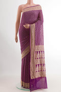 Purple Banarasi Georgette Saree with Zari Butta on the body and Zari Border.  displayed on a mannequin