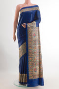 Blue Tussar Silk Saree with Plain Body and Printed Border.  displayed on a mannequin