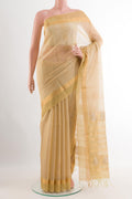 Beige Blended Kora Cotton Saree with Zari Butta on the body and Zari Border.  displayed on a mannequin