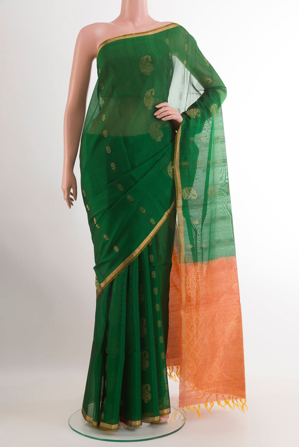 Green Silk Cotton Saree with Zari Butta on the body and Zari Border.  displayed on a mannequin