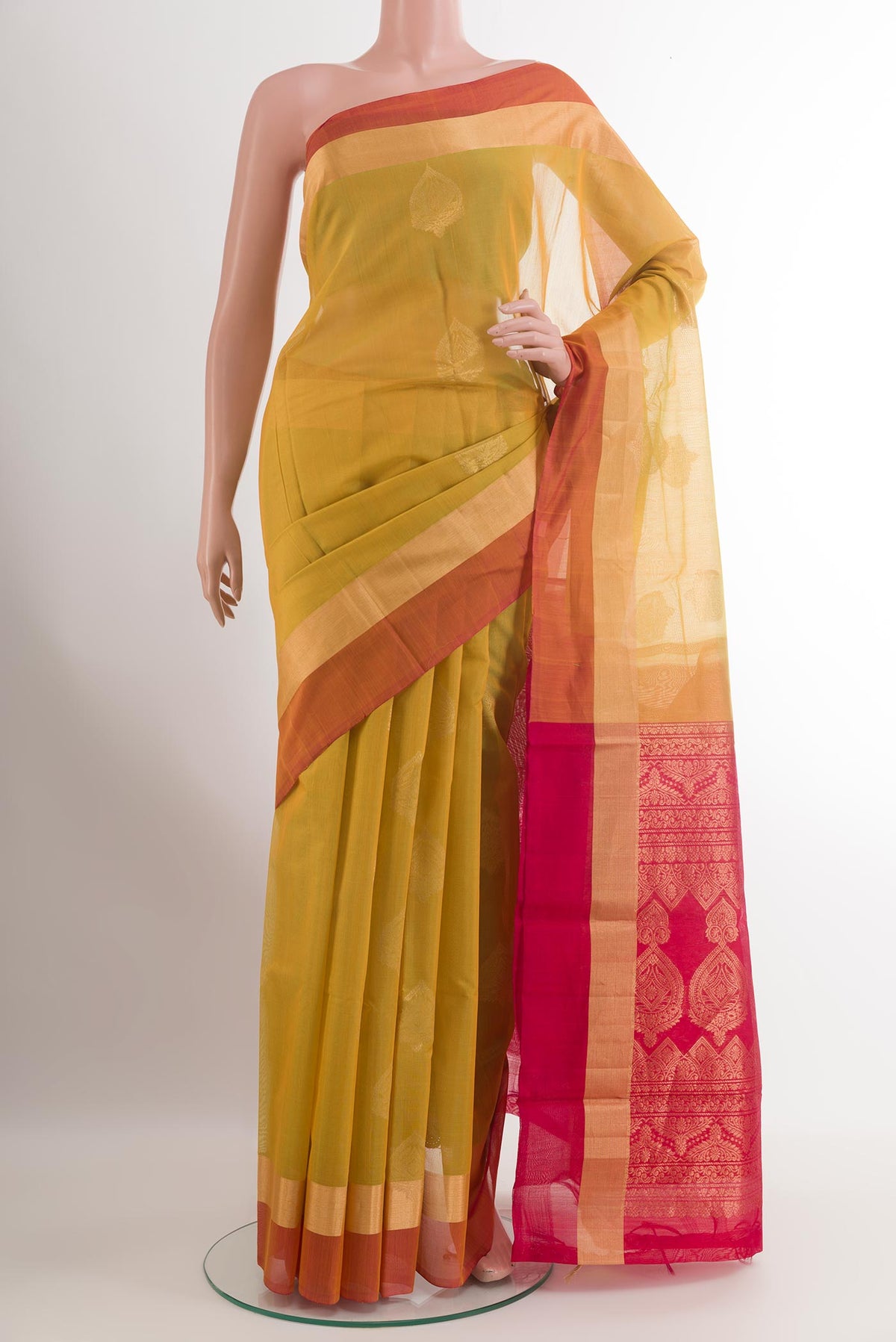 Lemon Yellow Silk Cotton Saree with Zari Butta on the body and Zari Border.  displayed on a mannequin