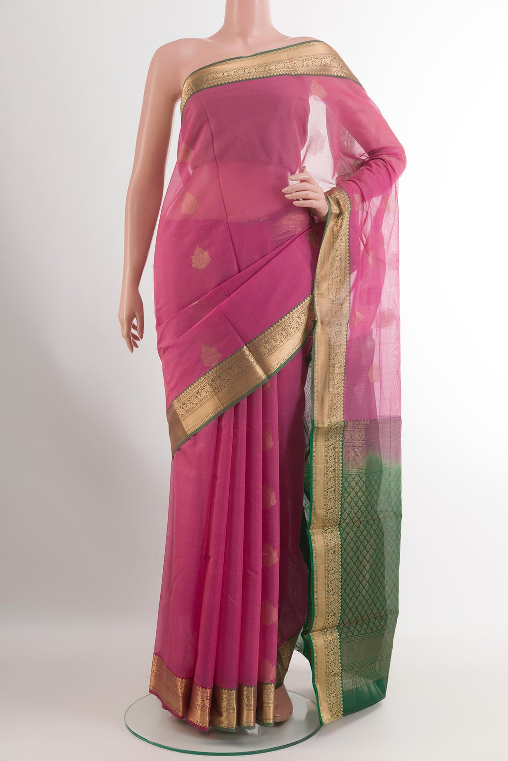 Pink Silk Cotton Saree with Zari Butta on the body and Zari Border.  displayed on a mannequin