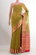 Green Silk Cotton Saree with Zari Butta on the body and Zari Border.  displayed on a mannequin