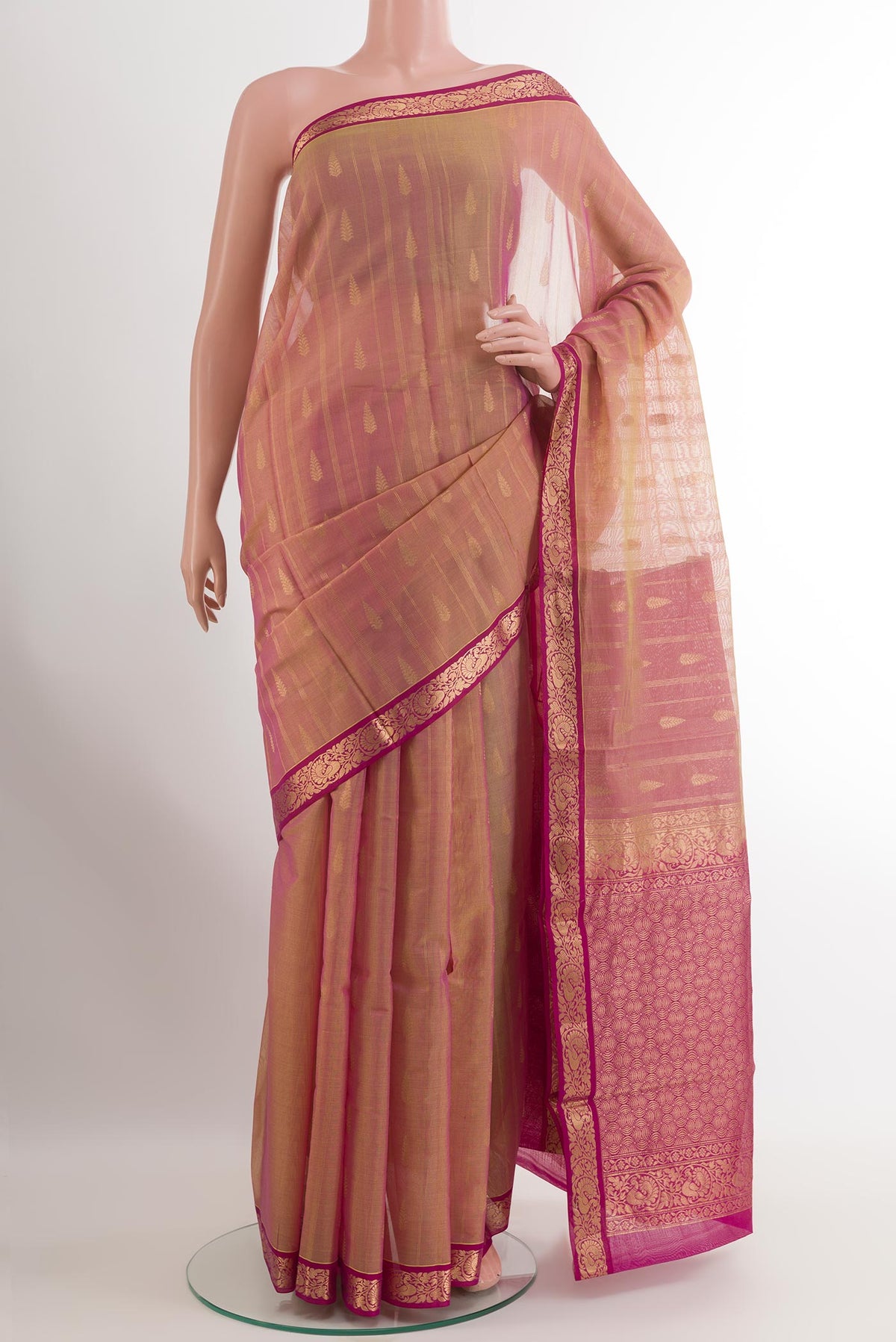 Pinkish Yellow Dual Tone Silk Cotton Saree with Zari Butta on the body and Zari Border.  displayed on a mannequin