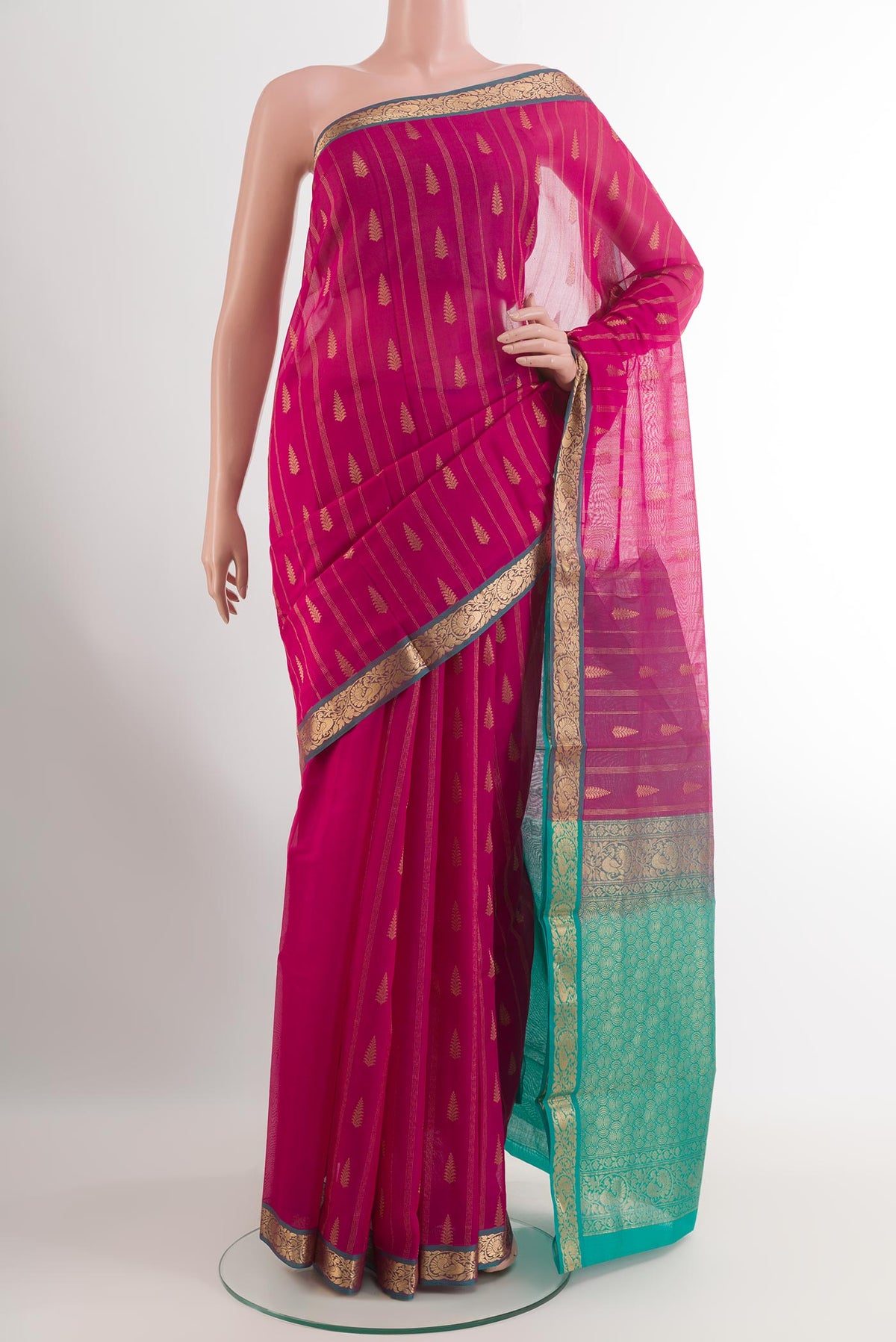 Pink Silk Cotton Saree with Zari Butta on the body and Zari Border.  displayed on a mannequin