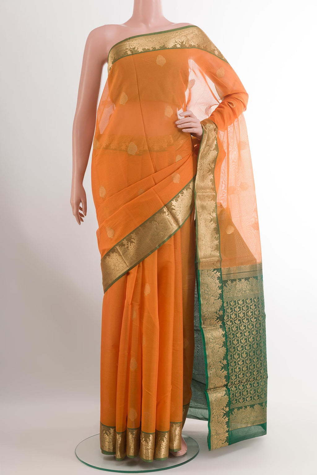 Yellow Silk Cotton Saree with Zari Butta on the body and Zari Border.  displayed on a mannequin
