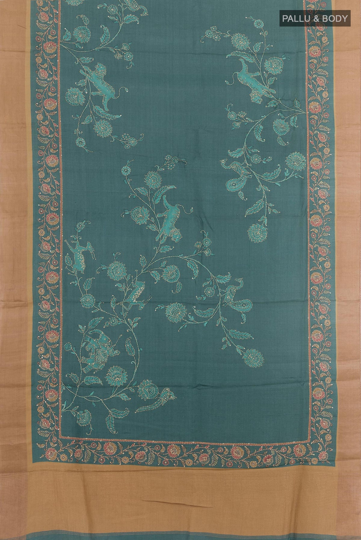 Flat view of Blue Grey Tussar Silk Saree with Embroidery on the body and Zari Border. 