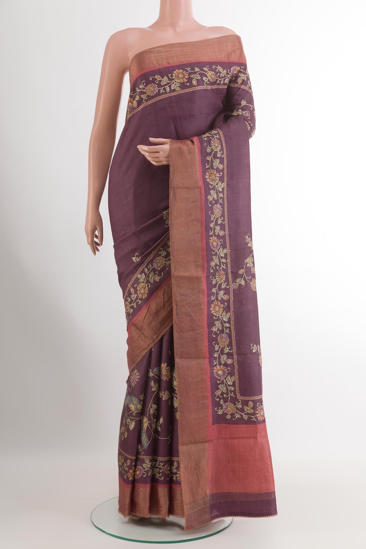 Purple Tussar Silk Saree with Embroidery on the body and Zari Border.  displayed on a mannequin