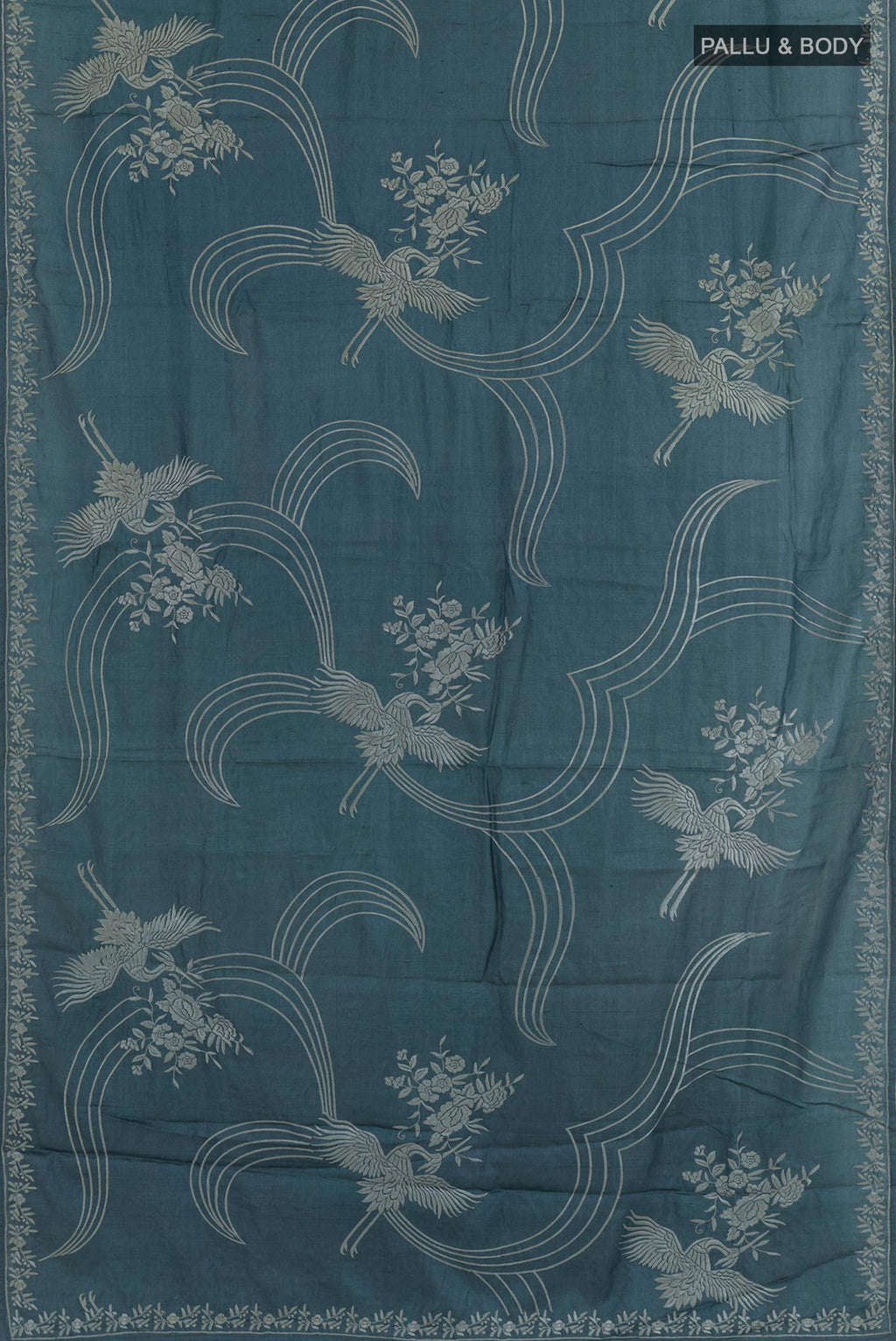 Flat view of Blue Tussar Silk Saree with Embroidery on the body and Embroidery Border. 