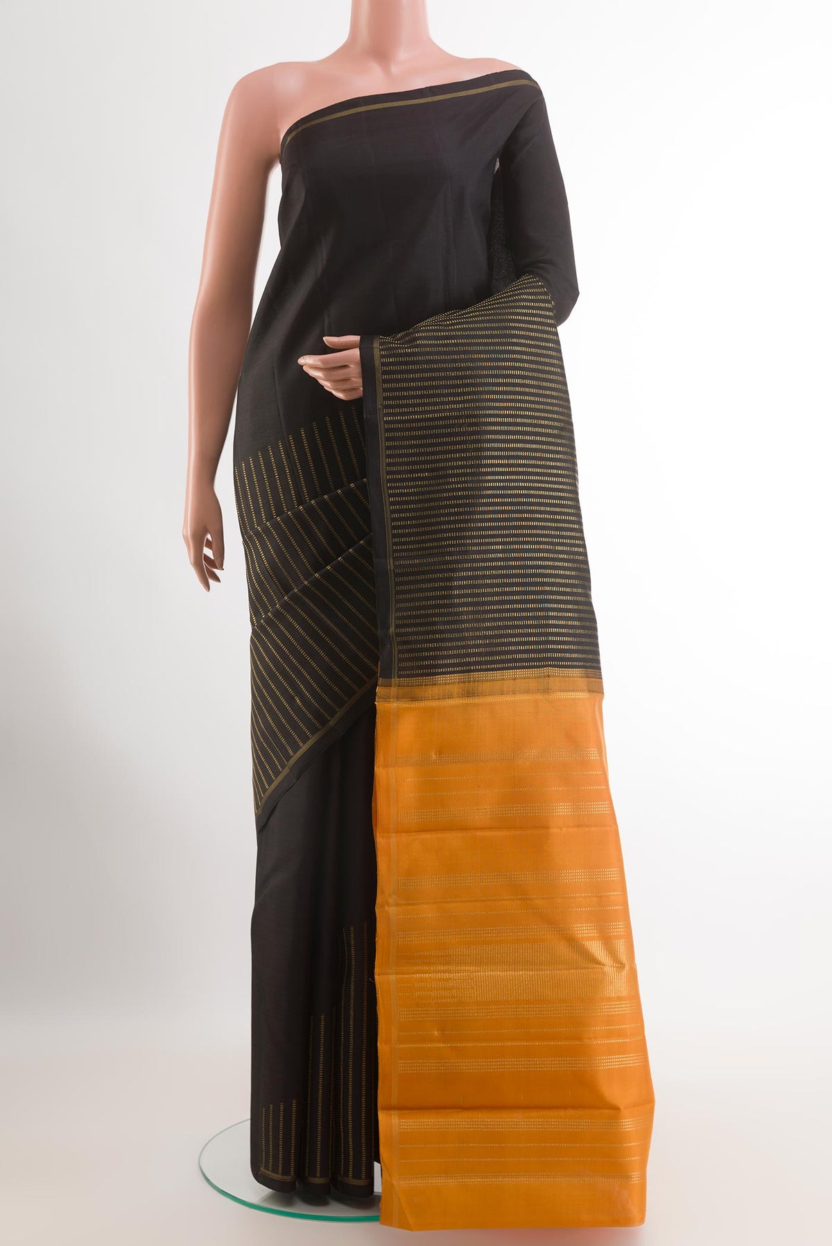 Pure Silk Pure Zari Black Kanchipuram Saree with Stripes on the body and Zari Border.  displayed on a mannequin