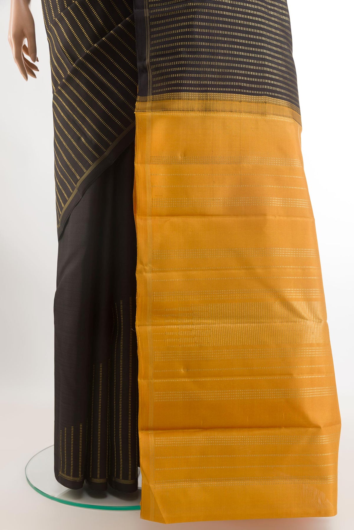 Pleats and pallu of Pure Silk Pure Zari Black Kanchipuram Saree with Stripes on the body and Zari Border. 