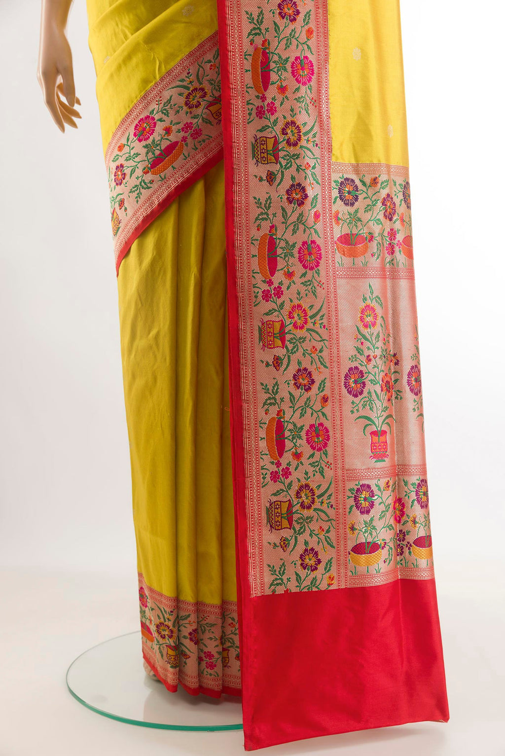Pleats and pallu of Yellow Banarasi Silk Saree with Zari Butta on the body and Paithani Border. 