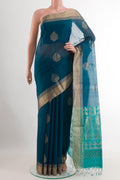 Blue Blended Kora Cotton Saree with Zari Butta on the body and Zari Border.  displayed on a mannequin